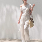 Linen off-shoulder asymmetric casual set by FitiqueFit in two colors, featuring relaxed fit top and matching pants, size S-L