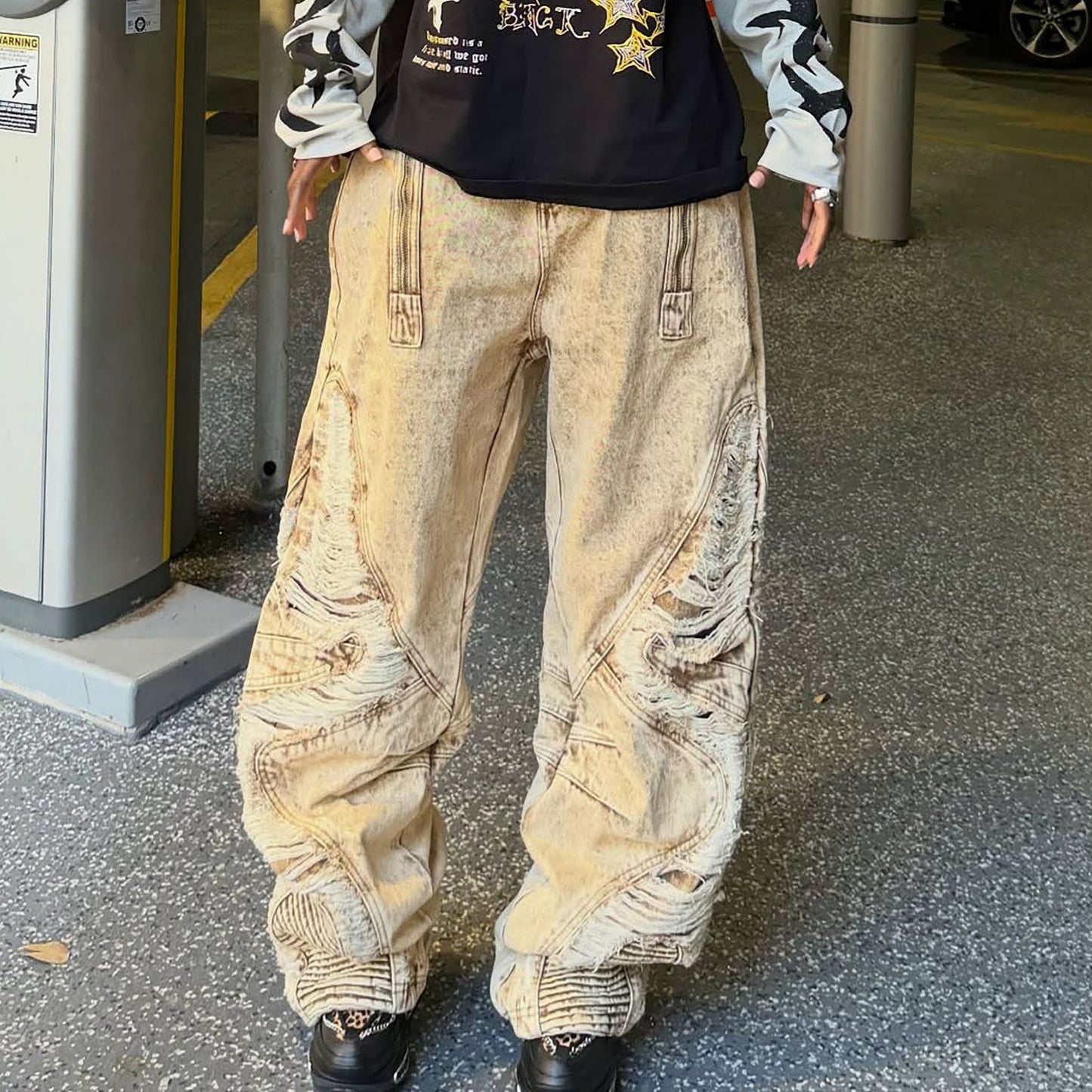 Distressed ripped jeans with irregular hem from Plush Fashion Hub, showcasing a casual, trendy denim style with frayed details.