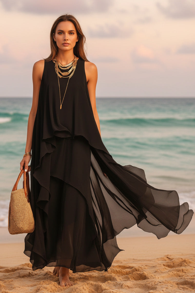 Flowy black asymmetrical chiffon maxi dress by FitiqueFit featuring sleeveless, boho A-line design for women.