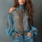 Women's retro cashew print off-shoulder blouse with lantern sleeves, casualwear by Plush Fashion Hub, shown on a model.
