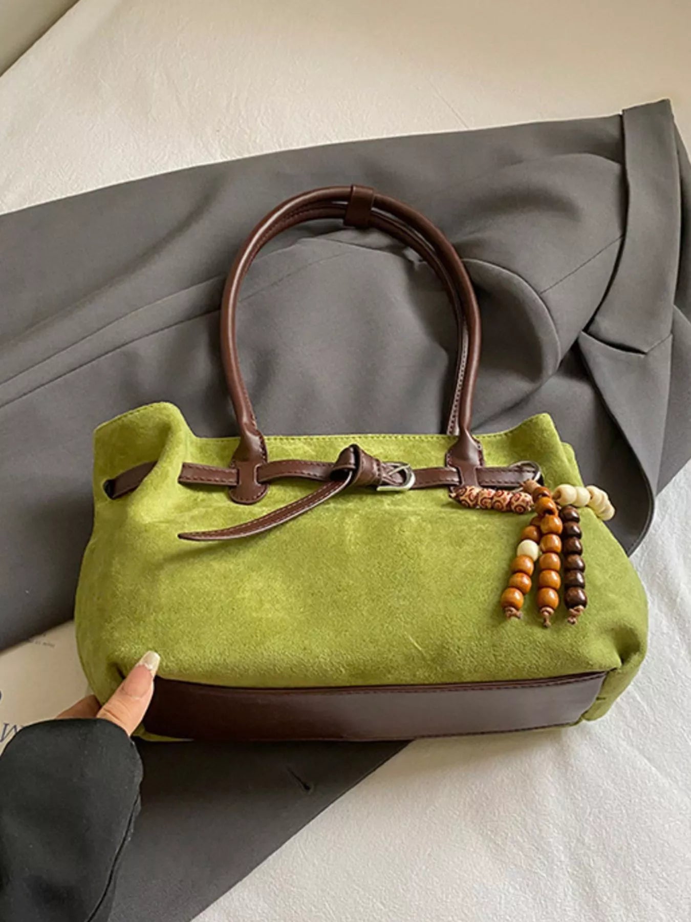 Vintage suede tote bag from Plush Fashion Hub featuring a spacious design and stylish brown suede material.