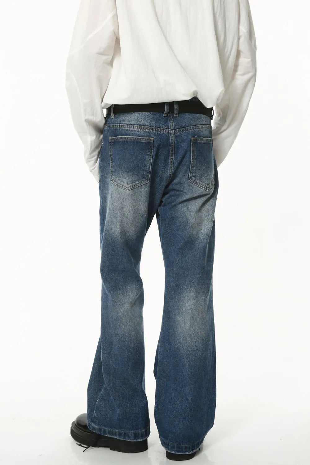 Worn washed denim jeans with front and back pockets from Plush Fashion Hub, casual style with a relaxed fit.