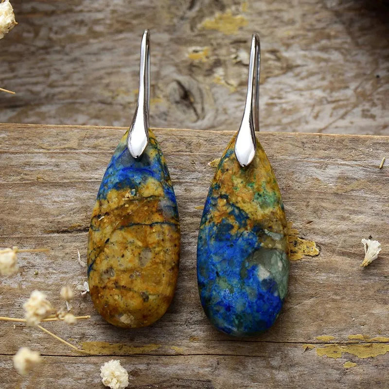 Teardrop-shaped natural stone dangle earrings from Shopimist, featuring elegant stone pendants hanging from silver hooks.