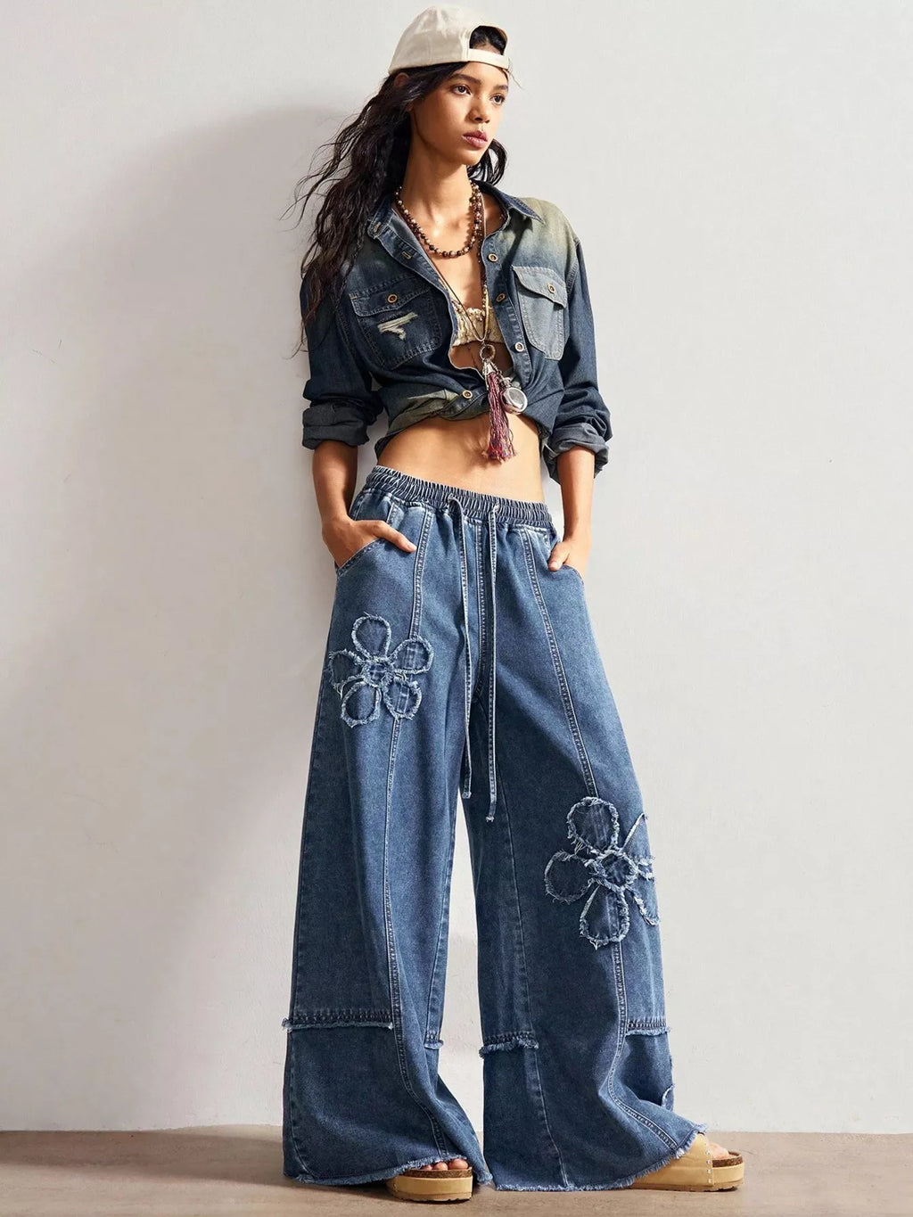 Shopimist floral appliques wide leg jeans with embroidered floral details and a relaxed fit, showcasing the stylish denim design.
