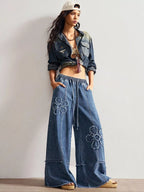 Shopimist floral appliques wide leg jeans with embroidered floral details and a relaxed fit, showcasing the stylish denim design.