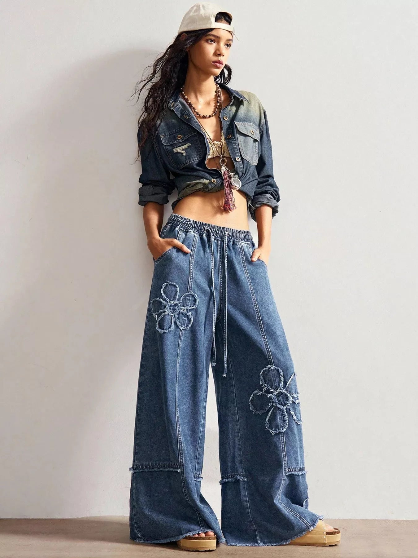 Shopimist floral appliques wide leg jeans with embroidered floral details and a relaxed fit, showcasing the stylish denim design.