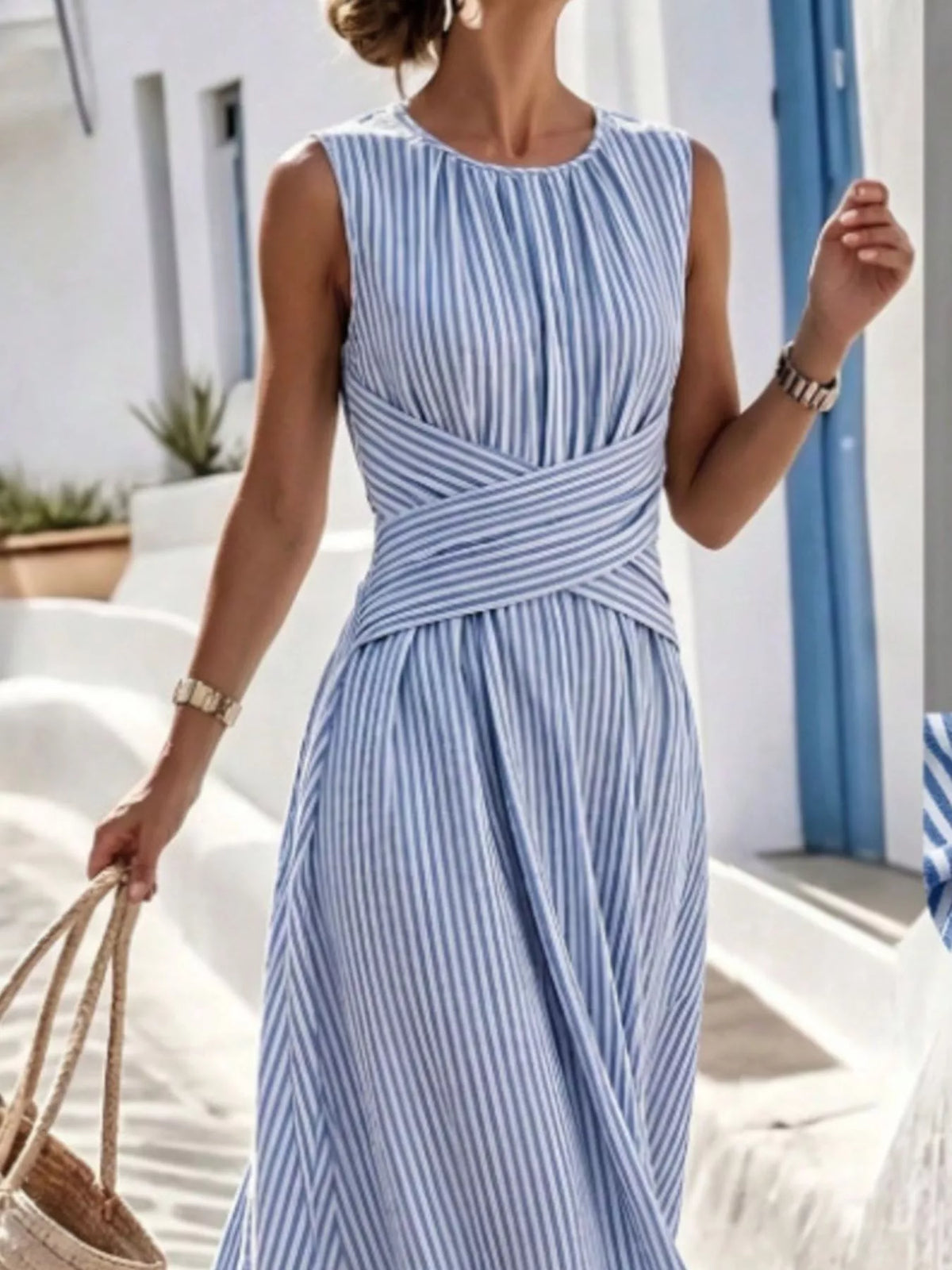 Plus size striped sleeveless maxi dress by Trendsi, featuring a full-length design with bold horizontal stripes and a flowing silhouette.