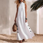 FitiqueFit sleeveless midi dress with side slits and loose fit, shown on a model in a casual outdoor setting.