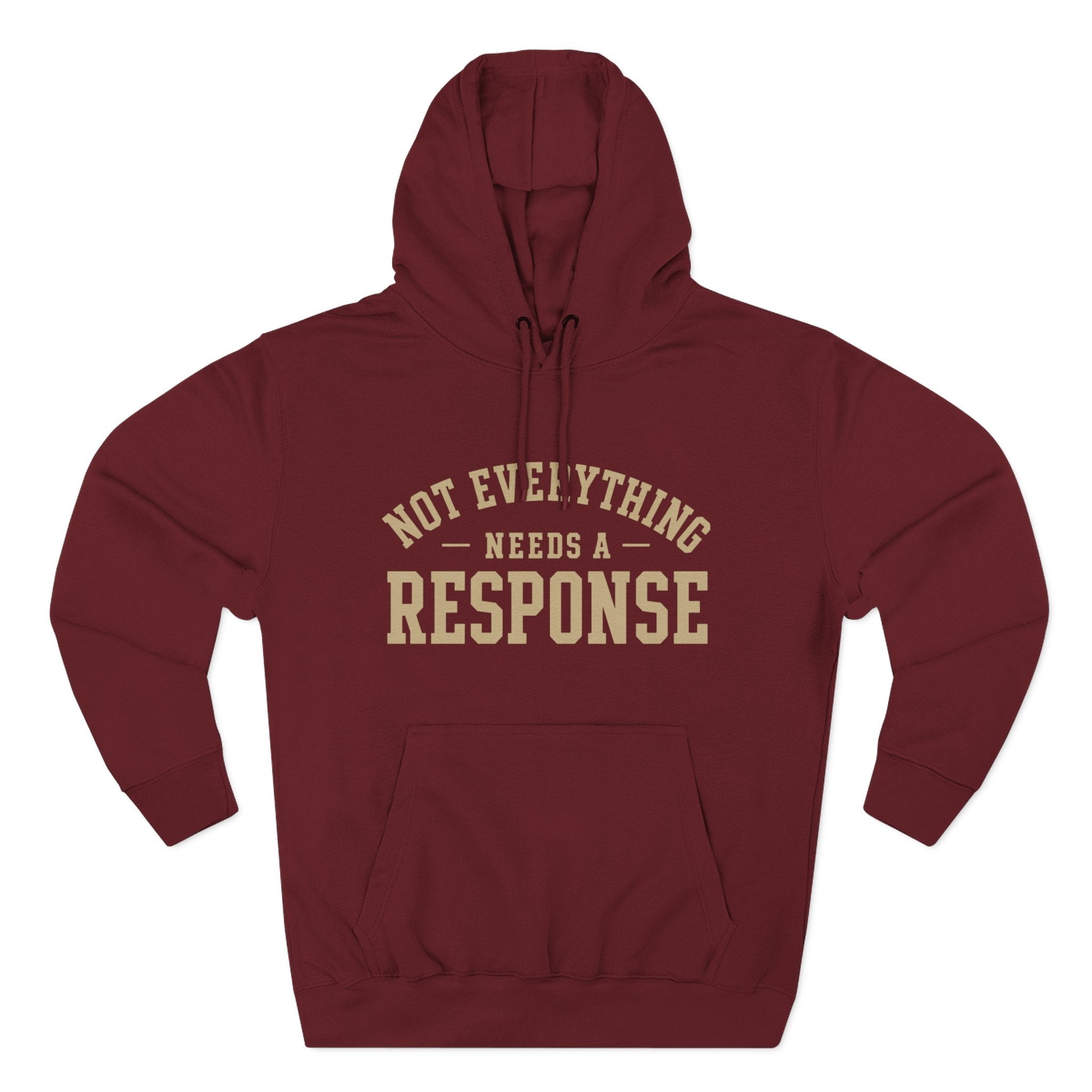 Black "Not Everything Needs a Response" hoodie by Wear Your Worship from the SEEN. Identity Line, featuring bold white text on the front.