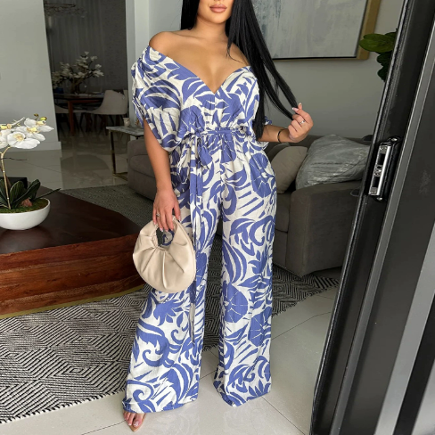 Women’s off-the-shoulder batwing sleeve printed jumpsuit by Bella Mia featuring wide-leg design and stylish pattern.