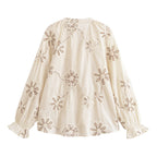 Women’s floral embroidered mini shirt by Bella Mia, featuring spring-inspired sweet floral design and lightweight fabric.