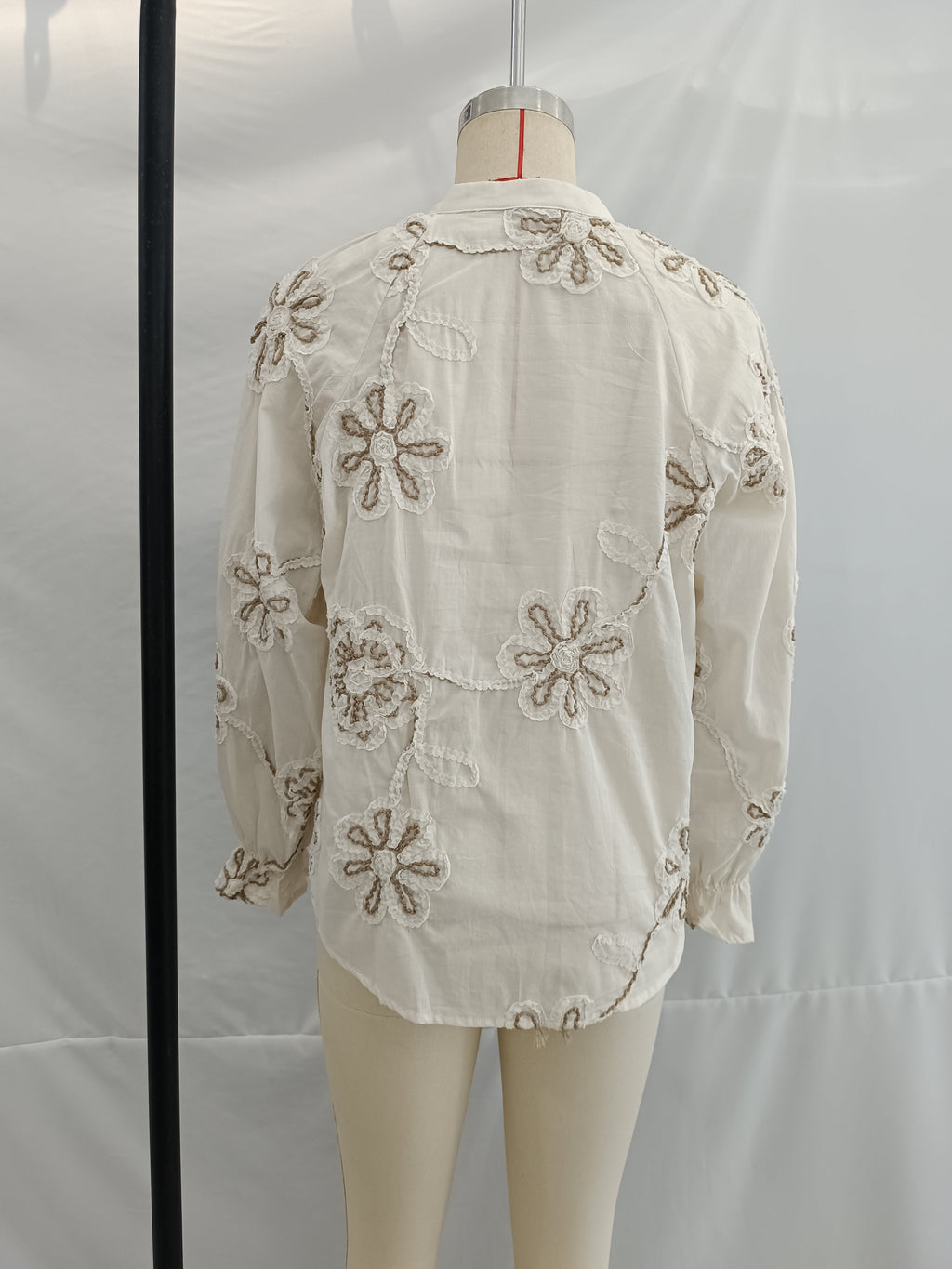 Women’s spring floral embroidered mini shirt by Bella Mia, featuring a sweet, colorful floral design and lightweight fabric.