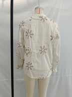Women’s spring floral embroidered mini shirt by Bella Mia, featuring a sweet, colorful floral design and lightweight fabric.