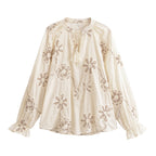 Women’s spring floral embroidered mini shirt by Bella Mia, featuring a sweet floral pattern and lightweight fabric.