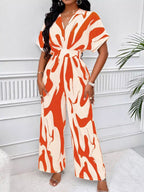 Abstract print wide-leg jumpsuit by Trendsi featuring a relaxed fit and stylish design, perfect for casual or trendy outfits.