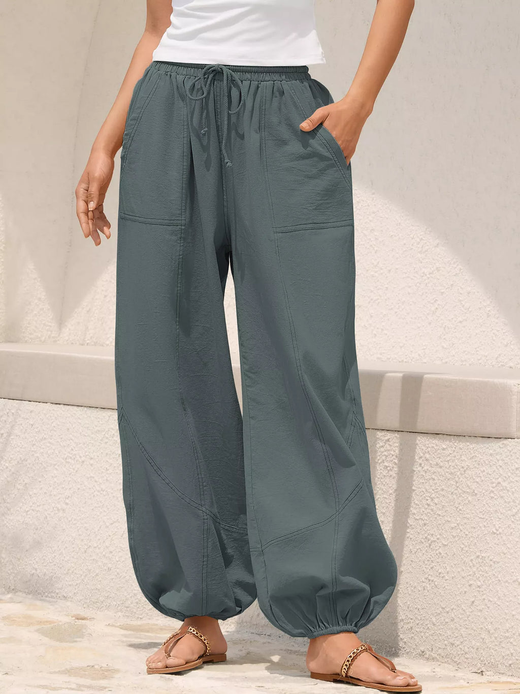 Casual loose-fit drawstring waist harem joggers from Trendsi, featuring relaxed fit and comfortable style with elastic cuffs.