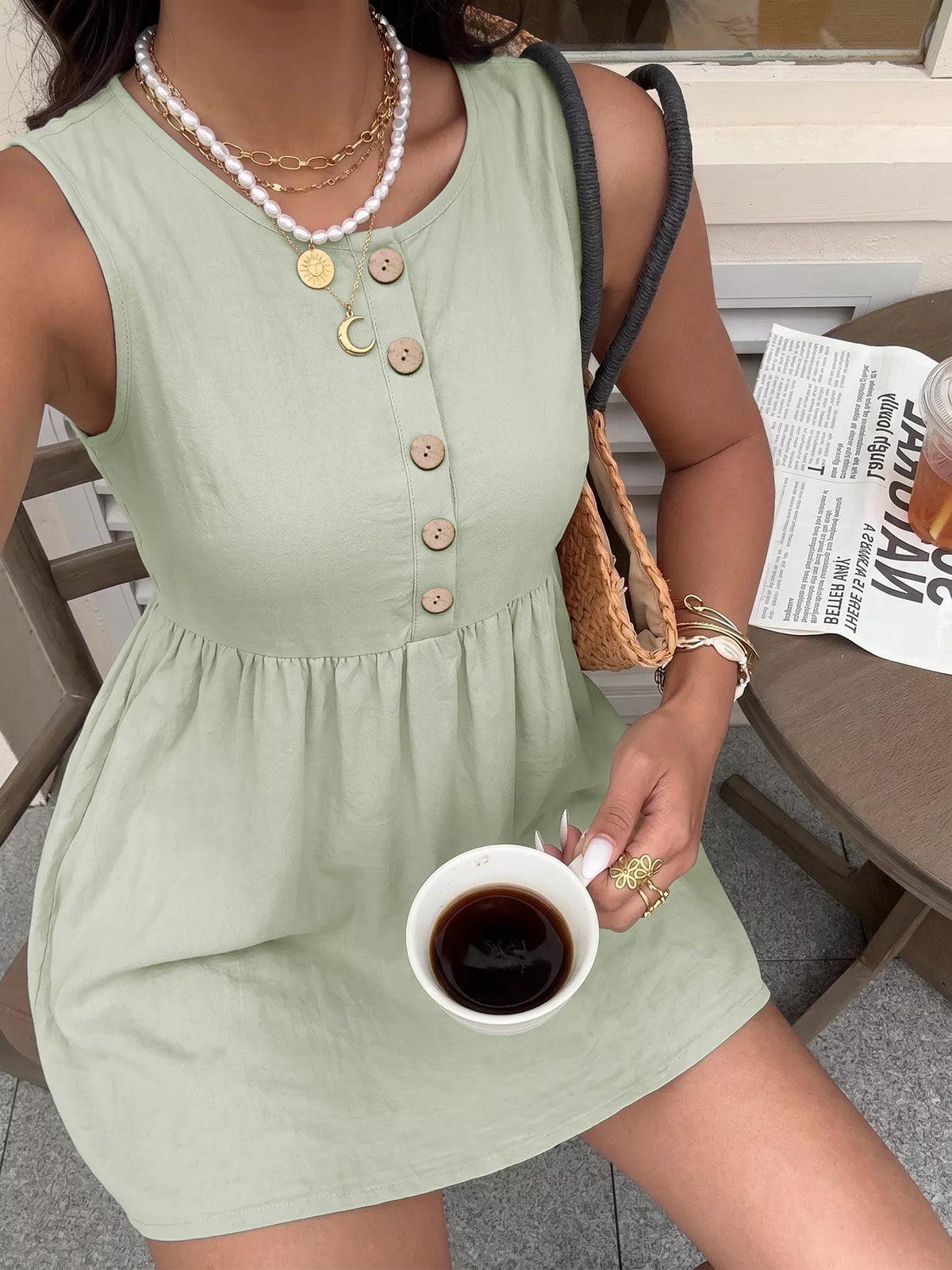 Sleeveless button-front A-line dress by Plush Fashion Hub featuring a fitted bodice and flowing skirt, perfect for casual or semi-formal wear.