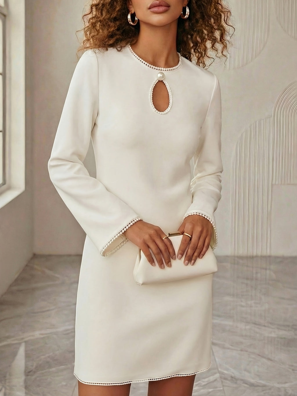Elegant keyhole pearl trim mini dress by Trendsi, perfect for cocktail parties, featuring a chic design and stylish details.