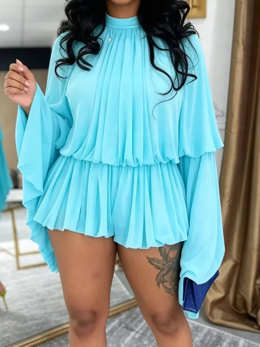 Trendsi pleated long sleeve top and skirt set, featuring a stylish matching skirt with pleats and long sleeves.