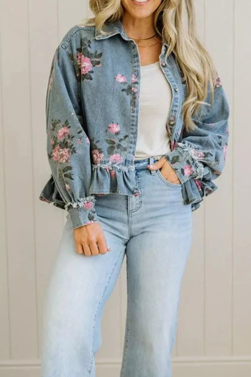 Floral print denim jacket with ruffled hem from Plush Fashion Hub, featuring colorful floral patterns and classic denim style.