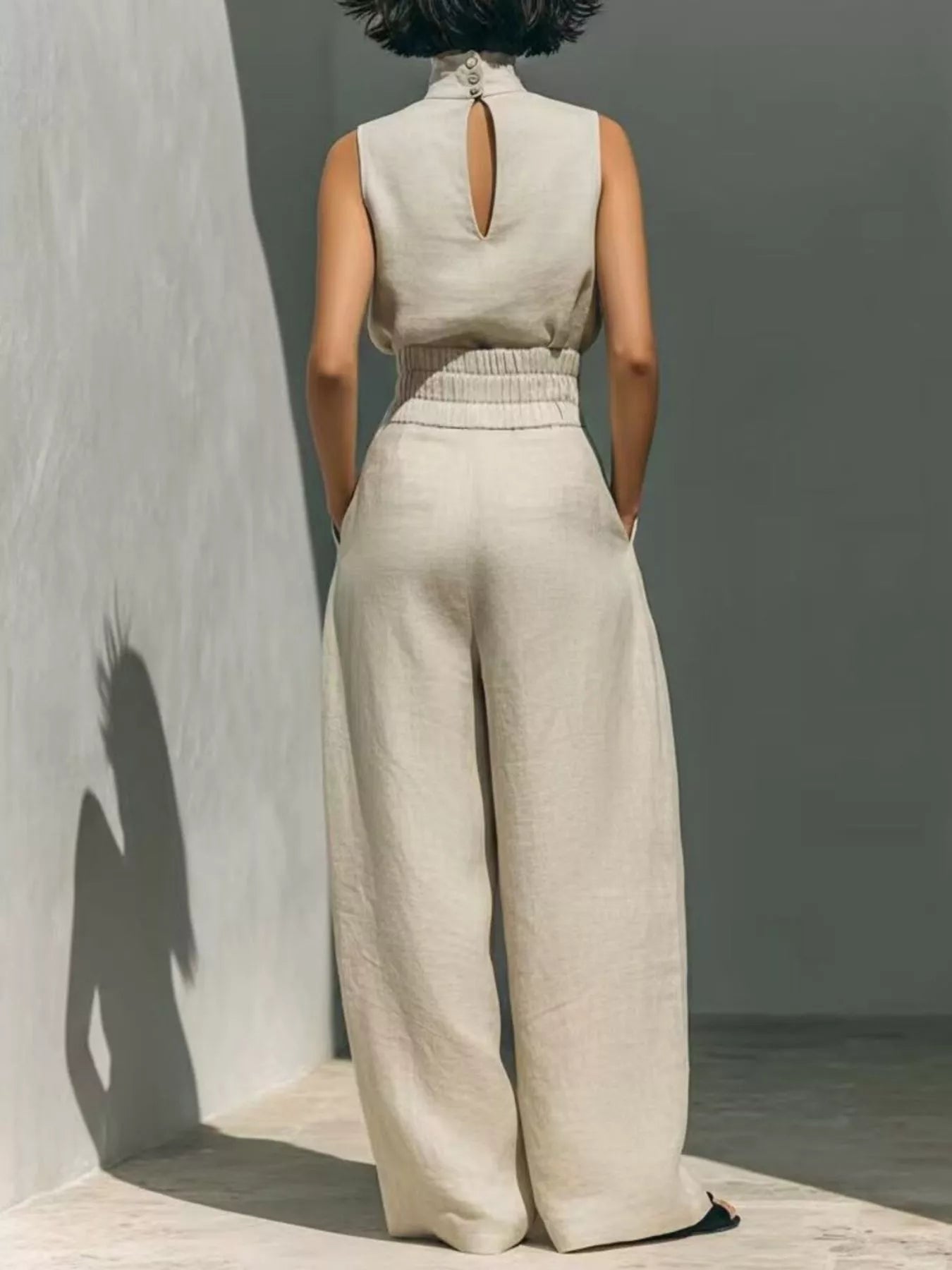 Plus size sleeveless wide-leg jumpsuit with smocked waist, full length, stylish and comfortable from Trendsi.