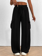 Women's high-waisted casual cargo pants with drawstring, lightweight utility pants from Trendsi, featuring multiple pockets and relaxed fit.