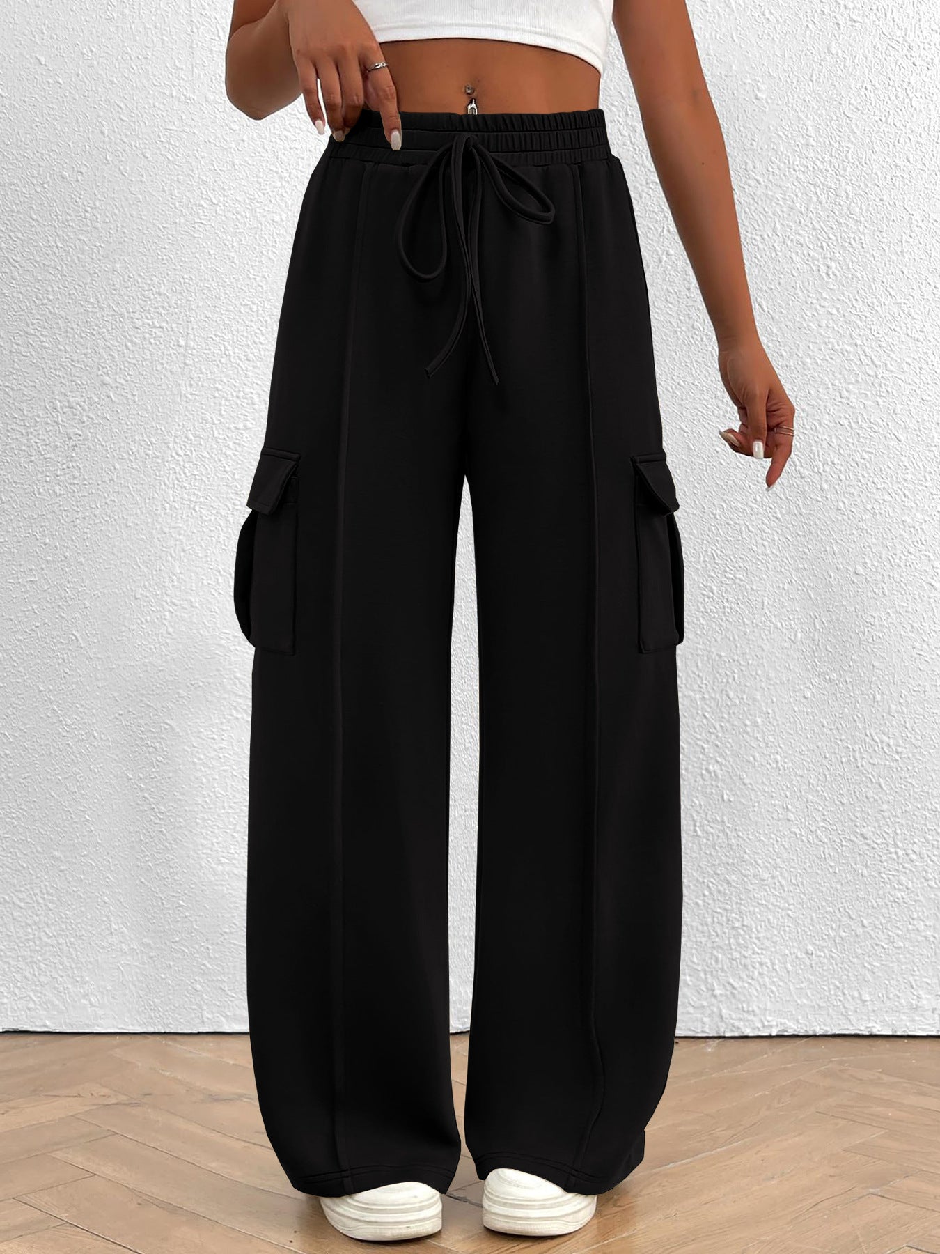 Women's high-waisted casual cargo pants with drawstring, lightweight utility pants from Trendsi, featuring multiple pockets and relaxed fit.