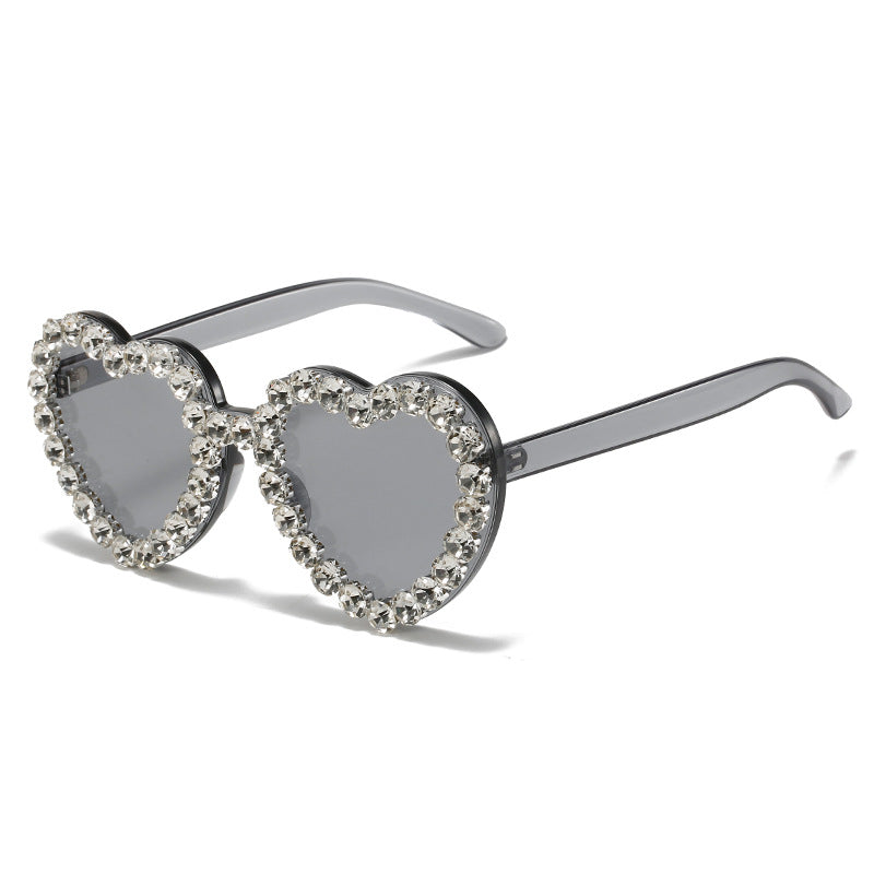 Peach heart-shaped Rhinestone sunglasses in Y2K style, featuring embellished frames and trendy eyewear design.