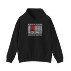 Unisex hoodie featuring biblical Revelation 1:5 inscription, inspirational red lettering on black Wear Your Worship apparel.