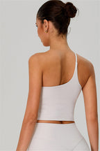 Fitglutes activewear one-shoulder crop top and shorts 2-piece set, stylish gymwear for workout and sports activities.
