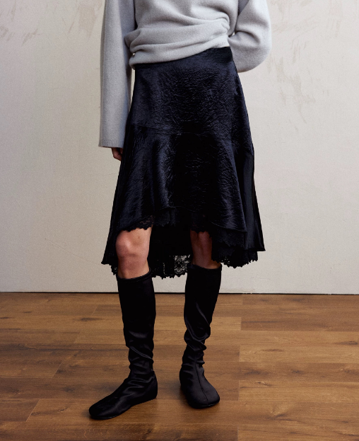 Elegant satin lace asymmetric skirt with irregular hem and stylish stitching, perfect for fashionable outfits by Plush Fashion Hub.
