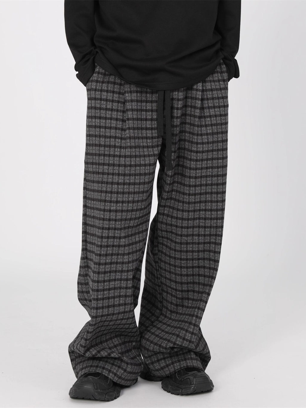 Men's plaid wide-leg casual pants with drawstring waist by Trendsi, featuring a relaxed fit and stylish plaid pattern.