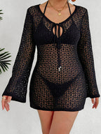 Women’s long sleeve beach cover-up dress with cutout and see-through fabric, stylish tied design by Plush Fashion Hub.