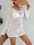 Women’s long sleeve beach cover-up dress by Plush Fashion Hub featuring see-through fabric, cutout details, and tie closure.