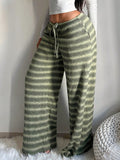 Women's casual straight-leg trousers with contrasting color striped design, slimming fit, and comfortable loose fit from Wanita Store.