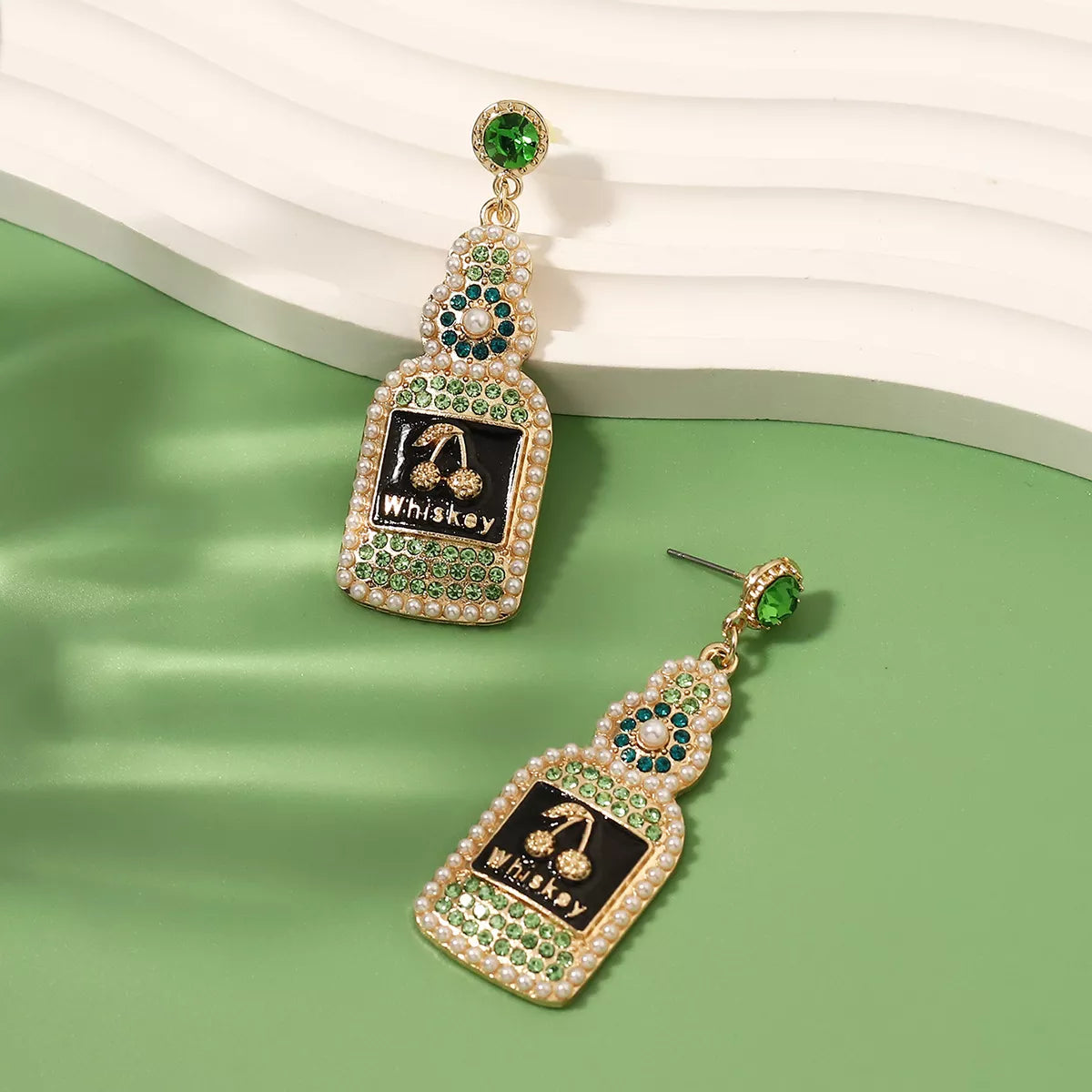 Whiskey bottle dangle earrings in gold tone, stylish jewelry for fashion accessories, featuring detailed whiskey bottle design.