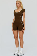 The Whisper Romper by Fitglutes Activewear features a fitted athletic design in lightweight fabric, suitable for gym and workout activities.