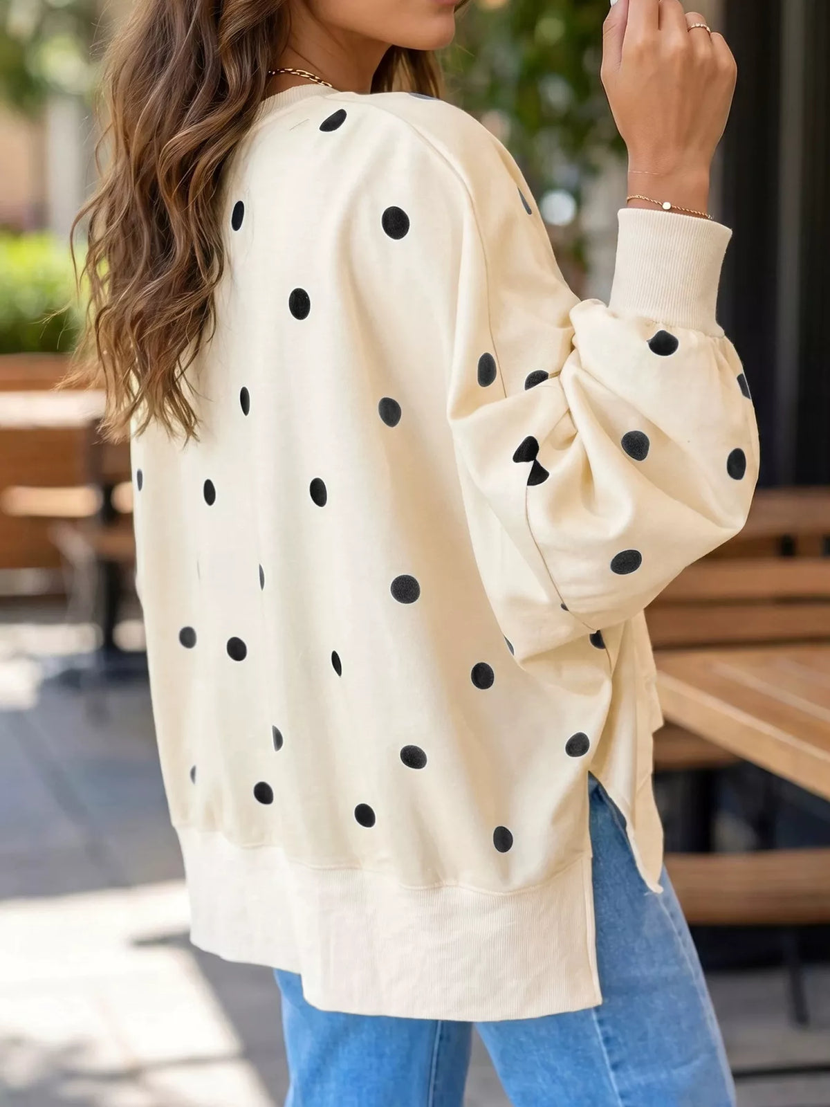 Polka dot oversized sweatshirt with side slit in black and white, casual Trendsi sweatshirt for comfortable everyday wear.