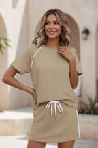 Women's drawstring short-sleeve top and mini skirt set by FitiqueFit, featuring casual, stylish summer outfit with breathable fabric.