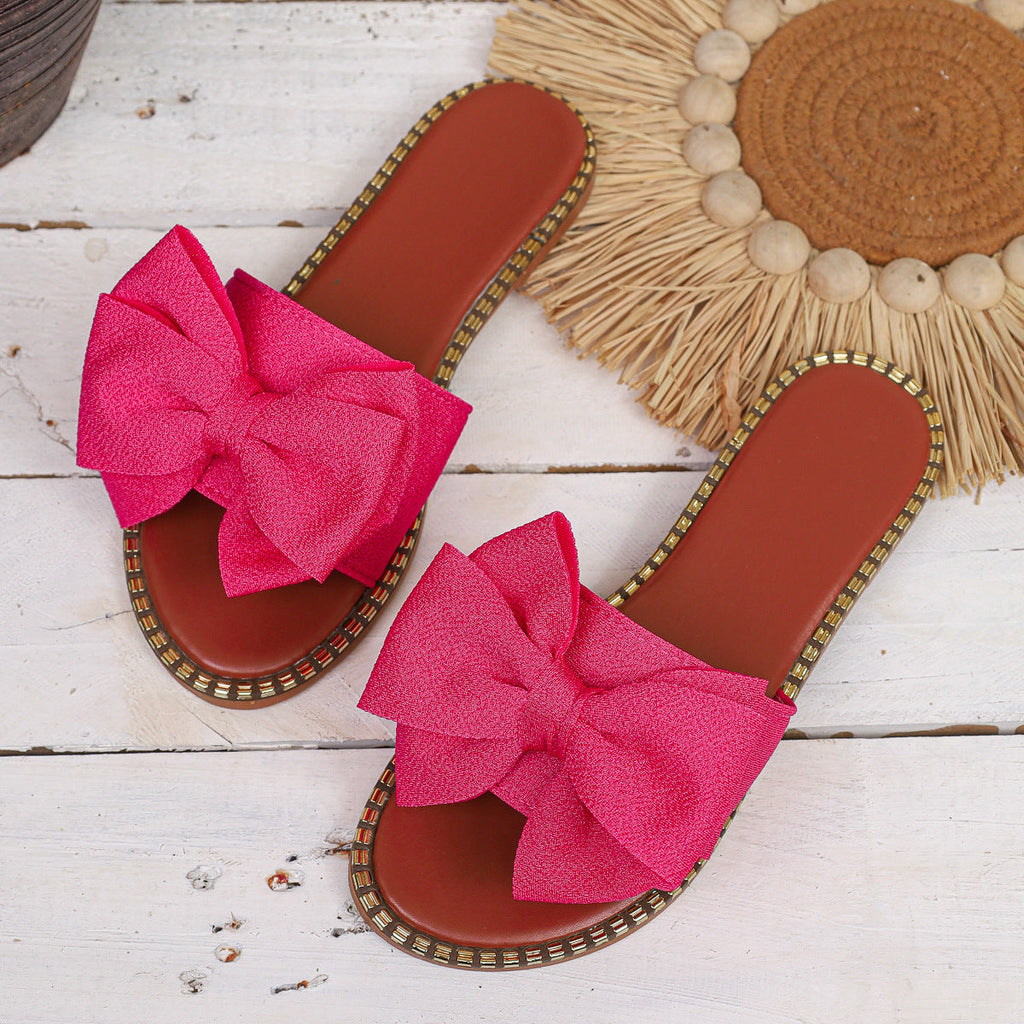 Shopimist bowknot embellished flat sandals with decorative bows and comfortable flat sole, perfect for casual or summer wear.