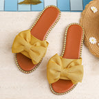 Shopimist bowknot embellished flat sandals with stylish design and comfortable fit, featuring decorative bow accents.