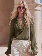 Shopimist ruffled V-neck long sleeve blouse with feminine ruffle details and V-neck design, shown in a stylish, flowy fabric.