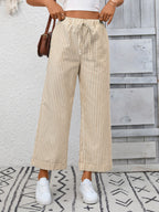 Women's striped wide-leg drawstring pants with pockets, stylish and comfortable from Trendsi, shown in a relaxed fit.