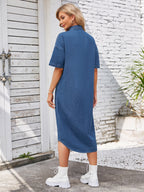 VYSN button-up dropped shoulder denim dress hanging on a hanger, showcasing its casual style and classic denim fabric.