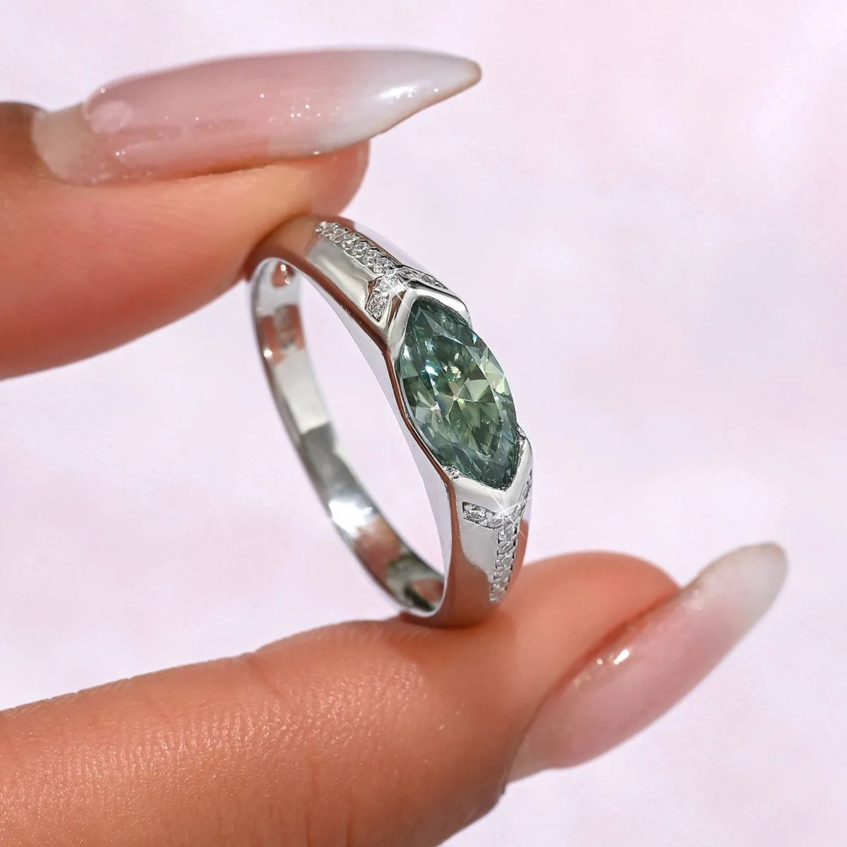 Sterling silver ring with 1 carat moissanite gemstone, showcasing a sparkling, elegant design from Plush Fashion Hub.