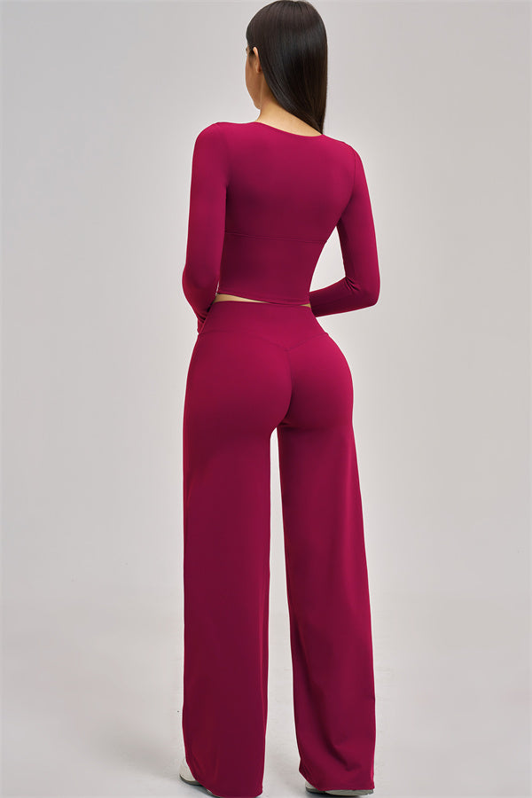 Fitglutes Activewear long sleeve crop top with fitted design, shown on a model for gym and workout wear.