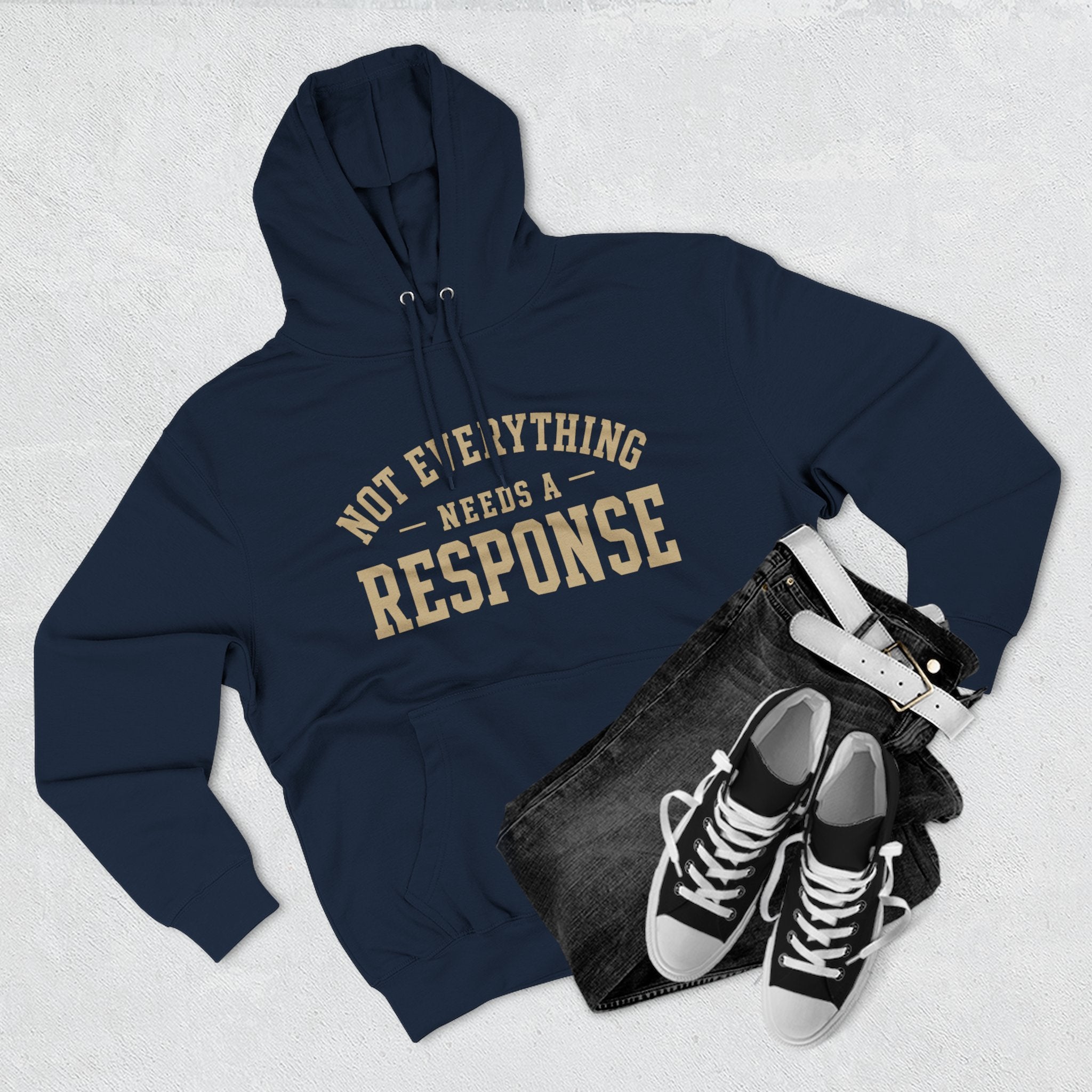 Black hoodie from Wear Your Worship's Not Everything Needs a Response SEEN. Identity Line, featuring a minimalist design.