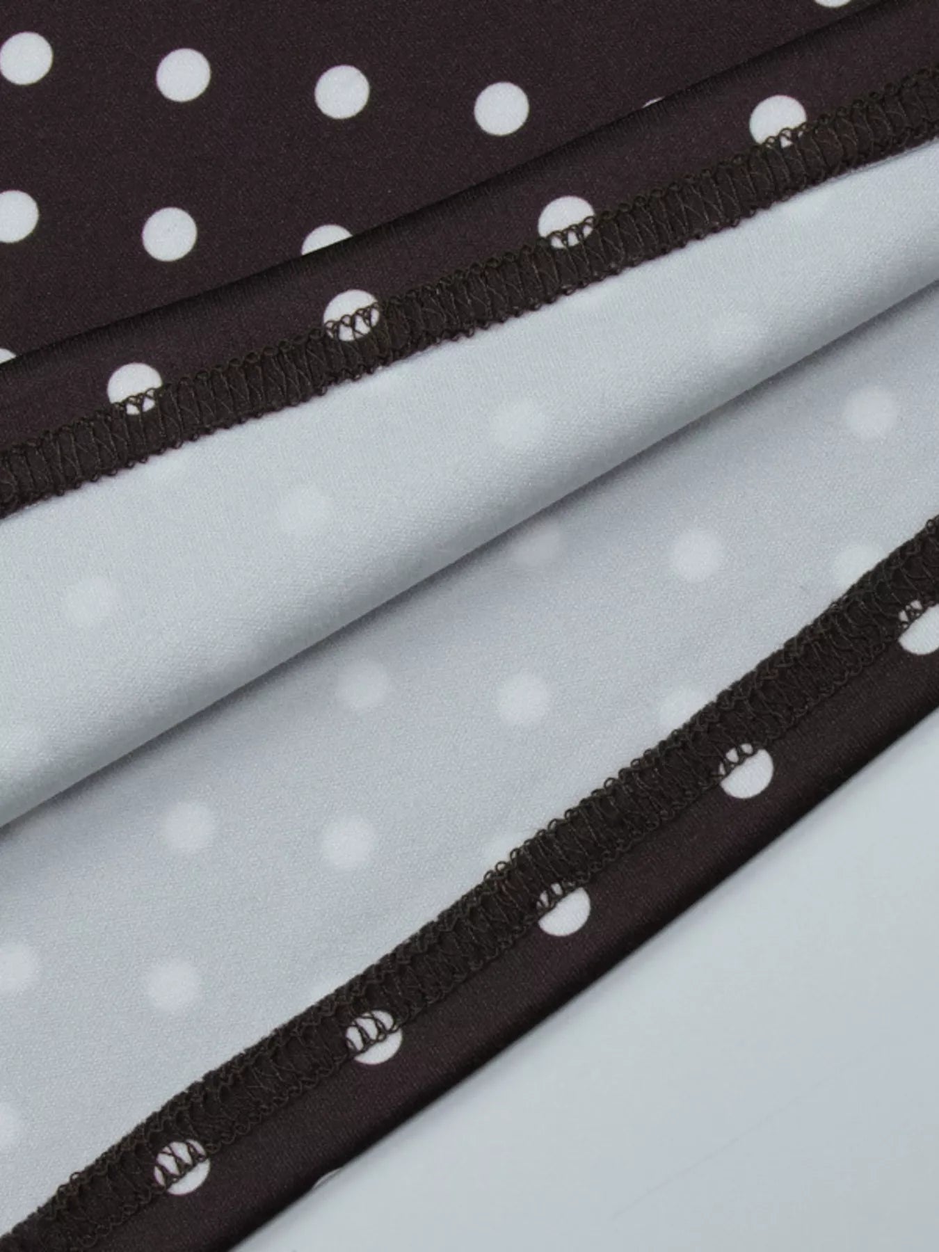 Polka dot mini dress with cut-out front by Shopimist, featuring a stylish and feminine design perfect for summer or casual wear.