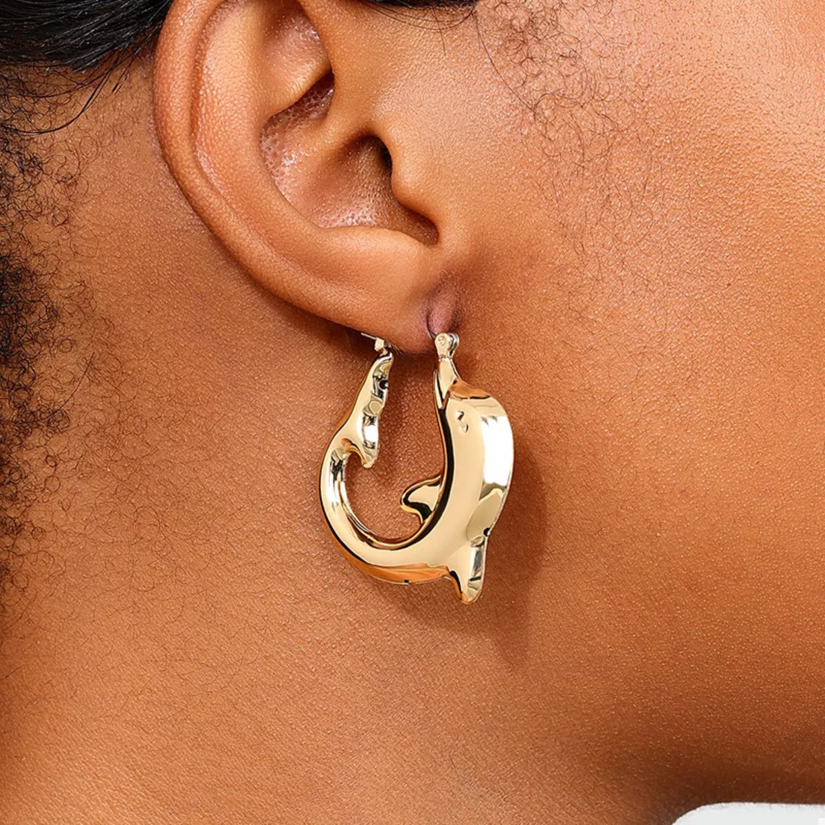 18K gold-plated dolphin hoop earrings with detailed dolphin design, crafted by Plush Fashion Hub.