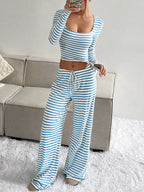 Striped long sleeve crop top and wide leg pants set by Trendsi, featuring stylish matching clothing for a trendy look.
